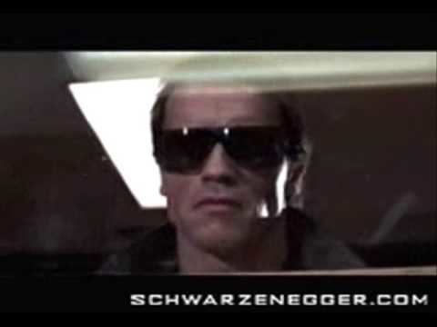 Arnold Schwarzenegger wearing shades and a black jacket