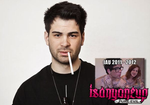 On the left, Hunter Moore is serious, standing with a cigarette in his mouth in a white background, has black hair, a lightly shaved mustache and beard, wearing a black shirt and silver necklace. At the left, is a box with a wording on top with “IAU 2011-2012” in the middle is two men sitting in a room naked, a man(left) is serious looking at his right, sitting with both hand closed below his right ear, has black hair, tattoo, wearing eyeglasses, naked, a man(right) is smiling, sitting, has long brown hair, tattooed body, naked, at the bottom is a wording “isanyoneup” in pink font, and “PURE EVIL” in black font.