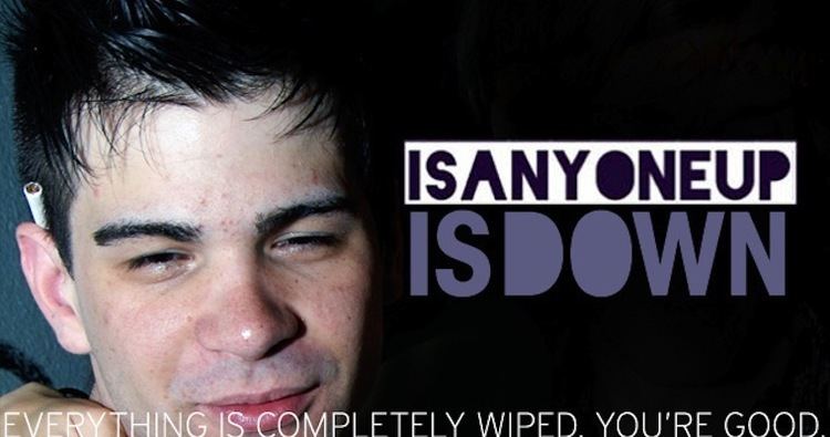 On the left, Hunter moore is smiling, has black hair with cigarette in his right ear, at the right is a wording “ISANYONEUP ISDOWN’’ at the bottom is a wording “EVERYTHING IS COMPLETELY WIPED YOU’RE GOOD”