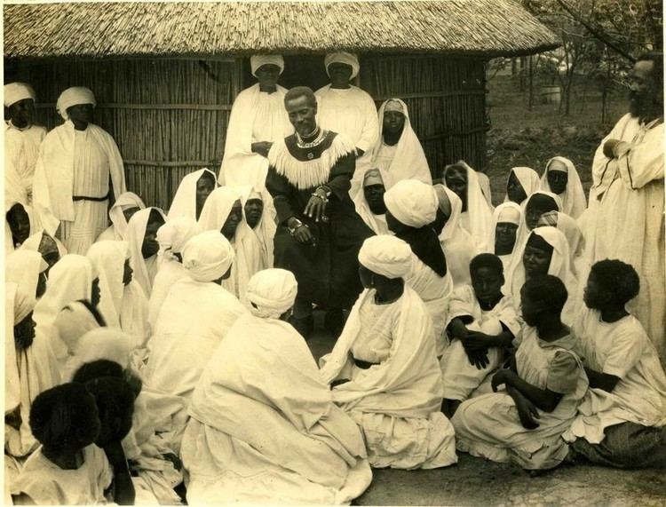 Isaiah Shembe surrounded by people wearing white dress