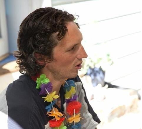 Israel Keyes wearing a flower necklace