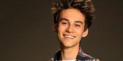 Jacob Collier with a smiling face.