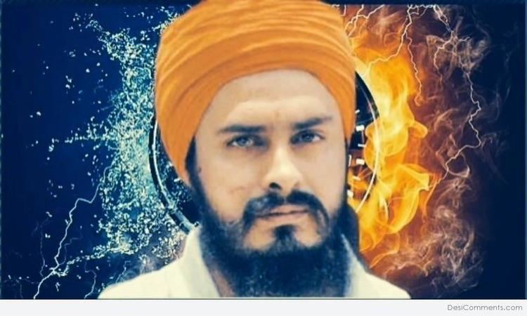 Jagtar Singh Hawara looking serious with a beard and mustache while wearing a white shirt and an orange turban