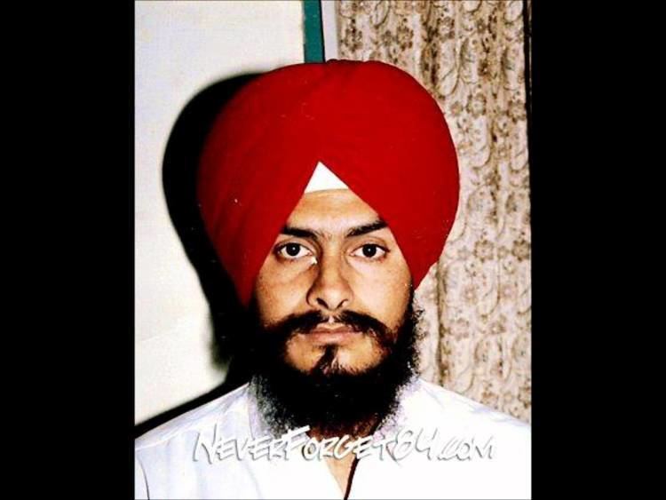 Jagtar Singh Hawara looking serious with a beard and mustache while wearing a white shirt and a red turban