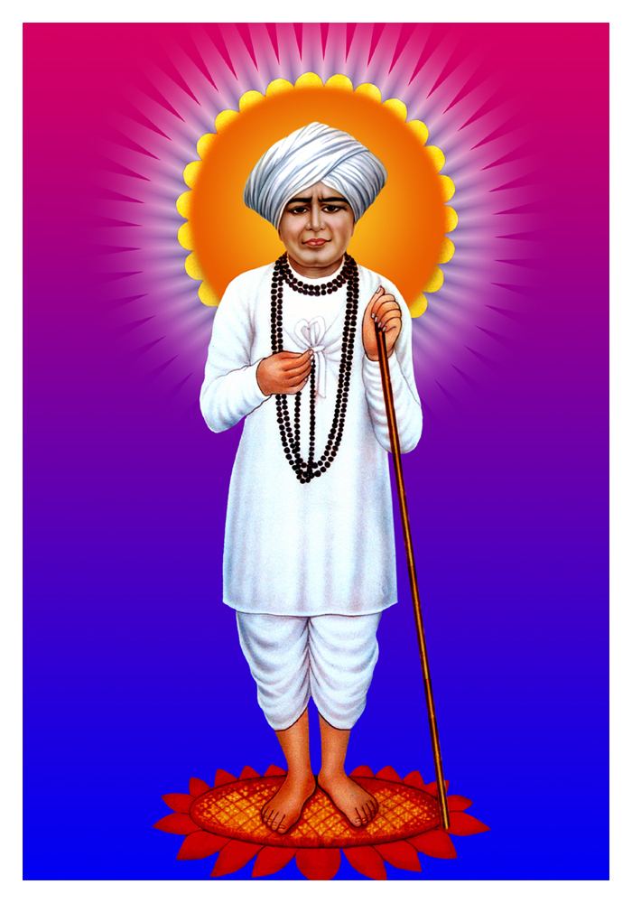 Jalaram Jay holding a wooden stick and necklace while wearing a white turban, white long sleeves, white pants, and a black beaded necklace