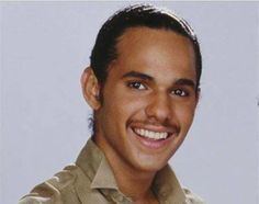 James DeBarge smiling while wearing a brown polo