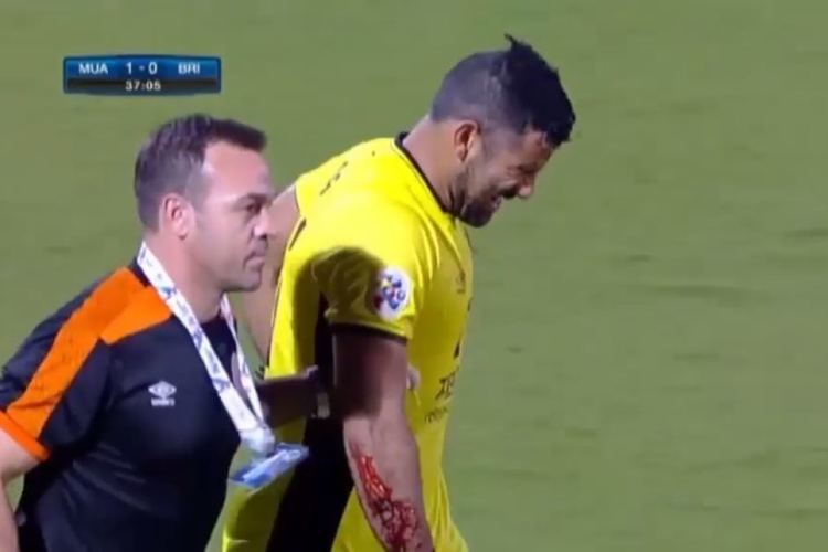 Jamie Young Brisbane Roar goalkeeper Jamie Young slices arm on goalpost during