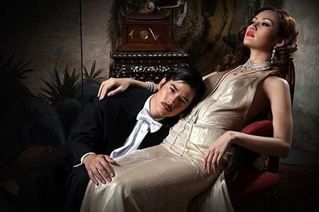 Yayaying Rhatha Phongam sitting on Mario Maurer’s lap in the 2012 movie, Jan Dara the Beginning