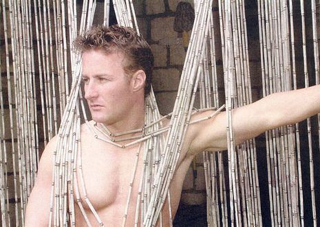 Jason Derek Brown in fierce look while in topless