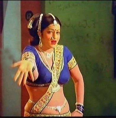 Jayamalini shows her palm, wearing many accessories, and a sexy blue and yellow top in a movie scene from Hanthakudi Veta (1987 film).