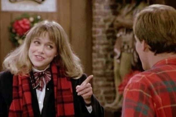 Jayne Modean pointing her index finger to a man in front of her in a movie scene from "Cheers (1987)"