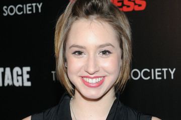 Jazmin Grace Grimaldi smiling while wearing a black sleeveless blouse and necklace