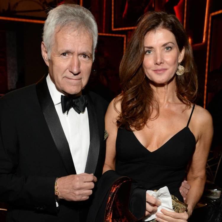 Alex Trebek holding Jean Trebek on her waist and both smiling during the 43rd AFI Life Achievement Award Gala