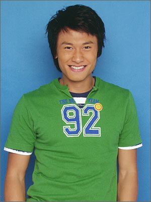 Jeff Wang wearing number 92 green and blue t-shirt