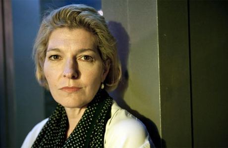 Jemma Redgrave looking serious in a white blouse and polka dot scarf