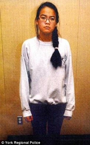 Jennifer Pan wearing eyeglasses, a white sweatshirt and pants