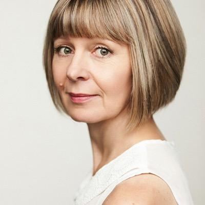 Jenny Funnell with short blonde hair and wearing a white top.