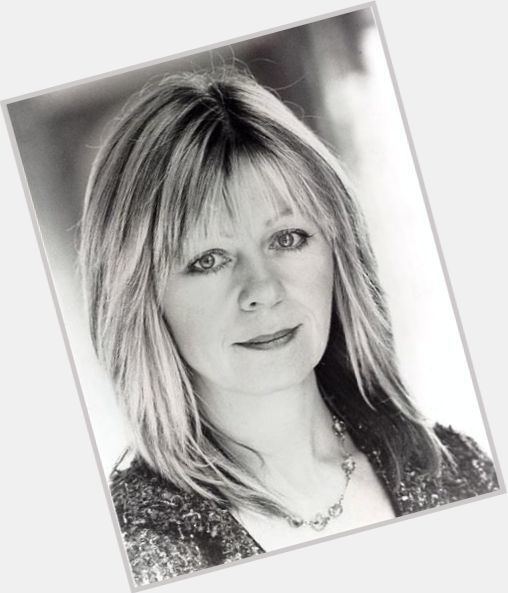 Jenny Funnell with a serious face, blonde hair and wearing a necklace.