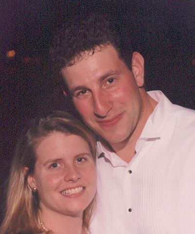 Jeremy Glick posing with his then wife Lyzbeth and wearing a white shirt.