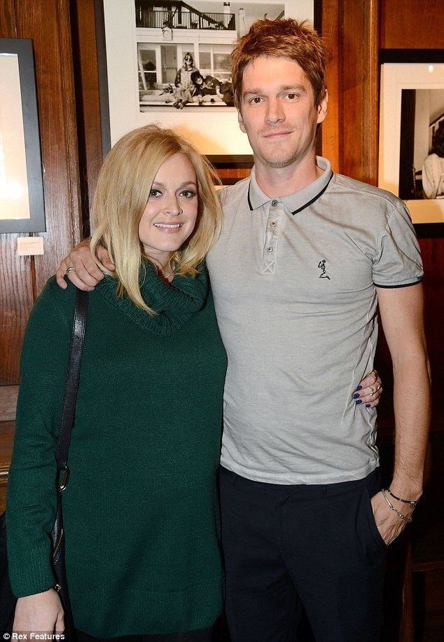 Jesse Wood Jesse Wood shows Fearne Cotton touching photographs of his