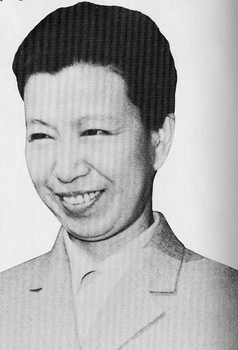 Jiang Qing smiling while wearing coat and inner blouse
