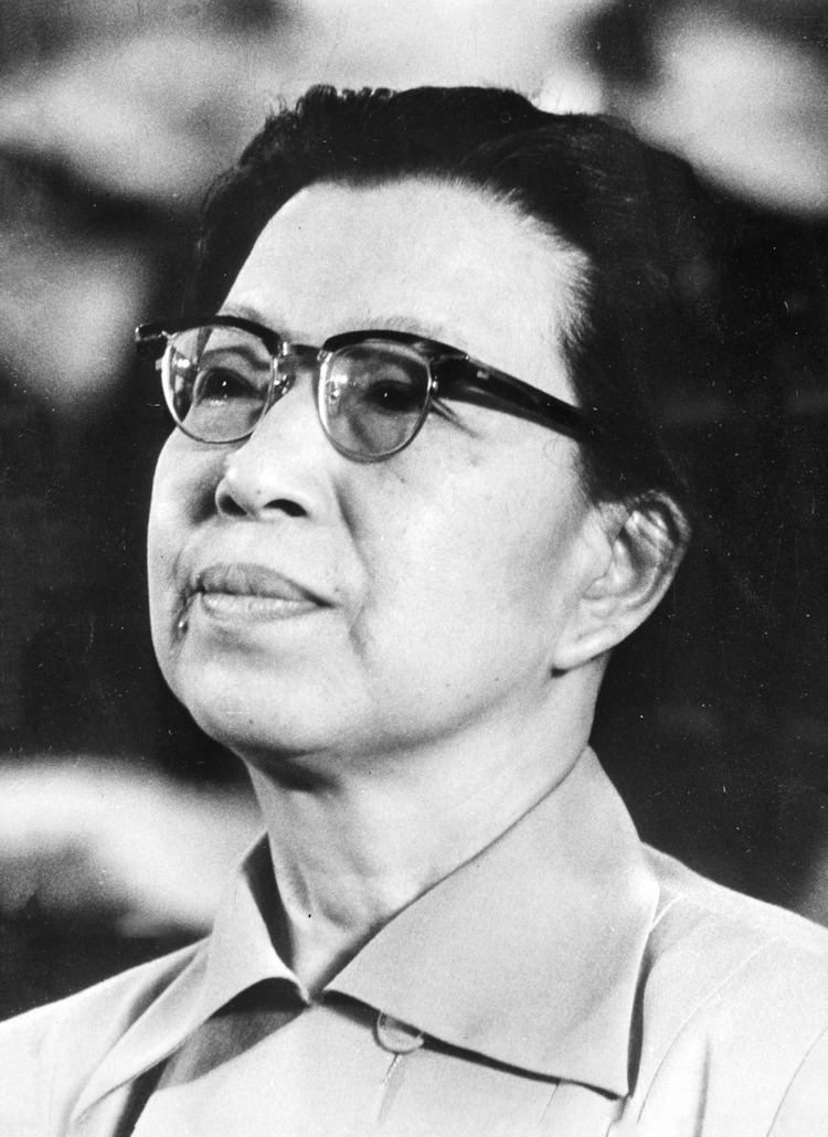Jiang Qing wearing eyeglasses and blouse