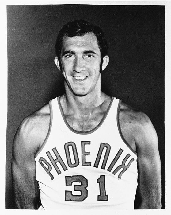 Jim Fox (basketball, born 1973) Center Jim Fox wears the original Phoenix Suns uniform from the