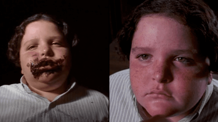Jimmy Karz eating a lot of chocolate as Bruce Bogtrotter in the 1996 movie "Matilda"  and wearing a white-striped shirt