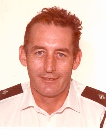 Jimmy Kinnon smiling while wearing a white uniform