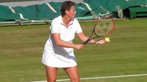 Jo Durie playing tennis and wearing her tennis jersey