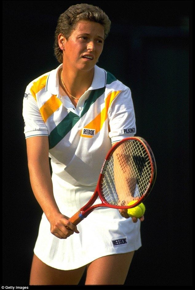 Jo Durie wearing her tennis jersey while playing tennis