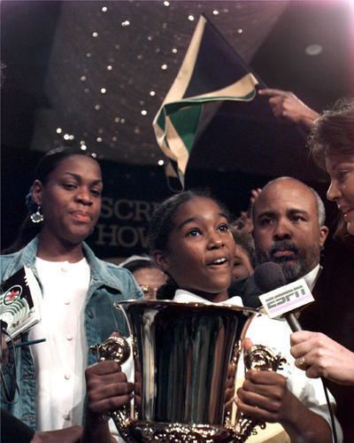 Jody-Anne Maxwell wearing a white polo shirt during the 1998 Scripps National Spelling Bee and made history as the first non-American to win the competition.