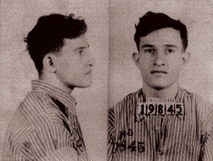 A mugshot of Joe Arridy when he was imprisoned for being falsely accused of rape and murder wearing prison clothes.