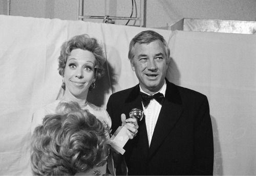 Carol Burnett, accompanied by her husband and producer Joe Hamilton, is seen clowning backstage, holding her Golden Globe in one hand and a wig in the other, at the Golden Globe Awards in Los Angeles on February 6, 1971. Burnett received the award in the category of âBest Television Show, Musical or Comedyâ