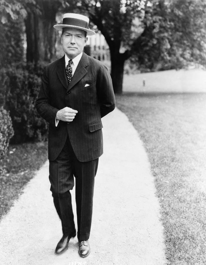 John D. Rockefeller, Sr. and his son John, Jr. leave a wedding in