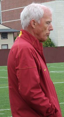 John McKay, Jr. side view, wearing a red jacket.