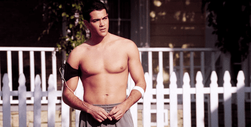 Jesse Metcalfe as John Rowland standing and shirtless in a scene from the TV series the "Desperate Housewives"