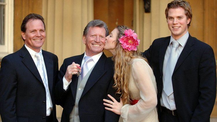 Johnny Briggs, with children (left to right) Mark, Stephanie, and Michael after collecting an MBE from the Queen at Buckingham Palace