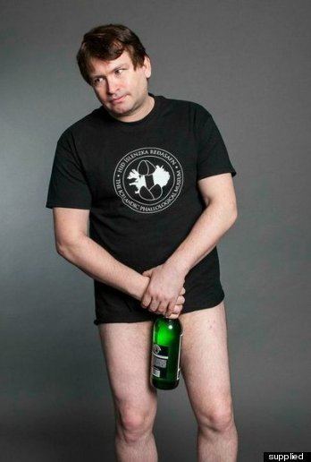 Jonah Falcon wearing black printed t-shirt while holding a bottle