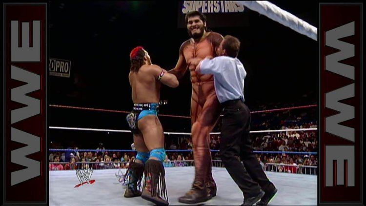 Jorge González wrestling against Tatanka and being stopped by the referee during the WWF Superstars on May 15th, 1993