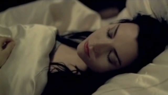 Amy lee is sleeping in a scene from the official music video of the song Bring Me To Life by Evanescence