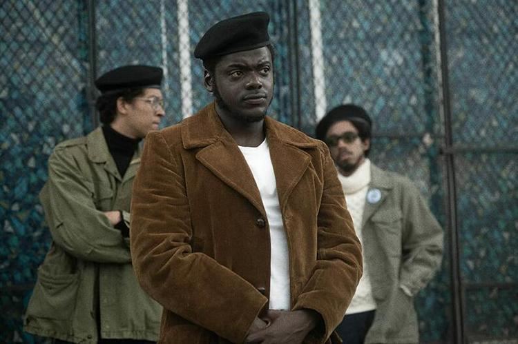 Daniel Kaluuya with Darrell Britt-Gibson and another man at his back in a scene from the 2021 American biographical film, Judas and the Black Messiah