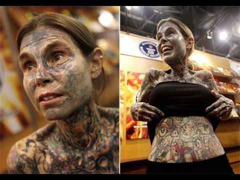On the left, Julia Gnuse wearing piercings and covered her body with tattoos. On the right, Julia Gnuse wearing a black top, black shorts and covered her body with tattoos.