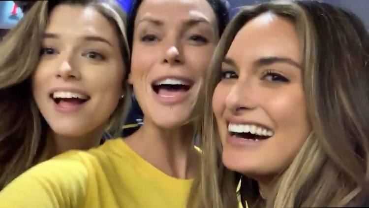 Julia Rose with Lauren Summer and Kayla Lauren with big smiles on their faces, and Lauren wearing a yellow shirt.