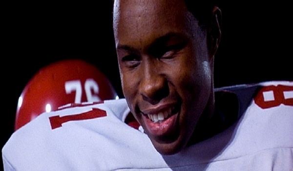 A movie scene from "Remember the Titans" (2000) featuring Wood Harris as Julius Campbell
