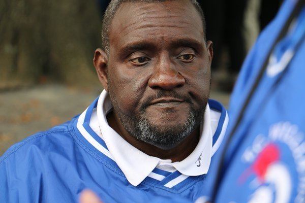 Julius Campbell looks emotional while wearing a football jersey