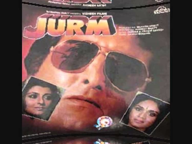 Vinod Khanna with a serious face and wearing sunglasses. Sangeeta Bijlani, on the left frame, with a tight-lipped smile and looking at something while Meenakshi Sheshadri, on the right frame, with a  serious face and a bindi on her forehead in the movie poster of the 1990 Indian Hindi-language action film, Jurm