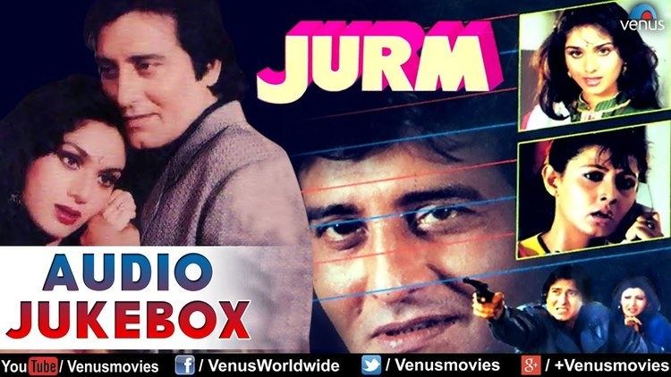 A cover of the audio jukebox of the 1990 film "JURM" starring Vinod Khanna as Inspector Shekhar Varma and Meenakshi Sheshadri as Meena Varma (left) together with the other cast of the film (right). Vinod and Meenakshi with a tight-lipped smile while looking at something and holding each other's hands. Vinod is wearing a gray coat