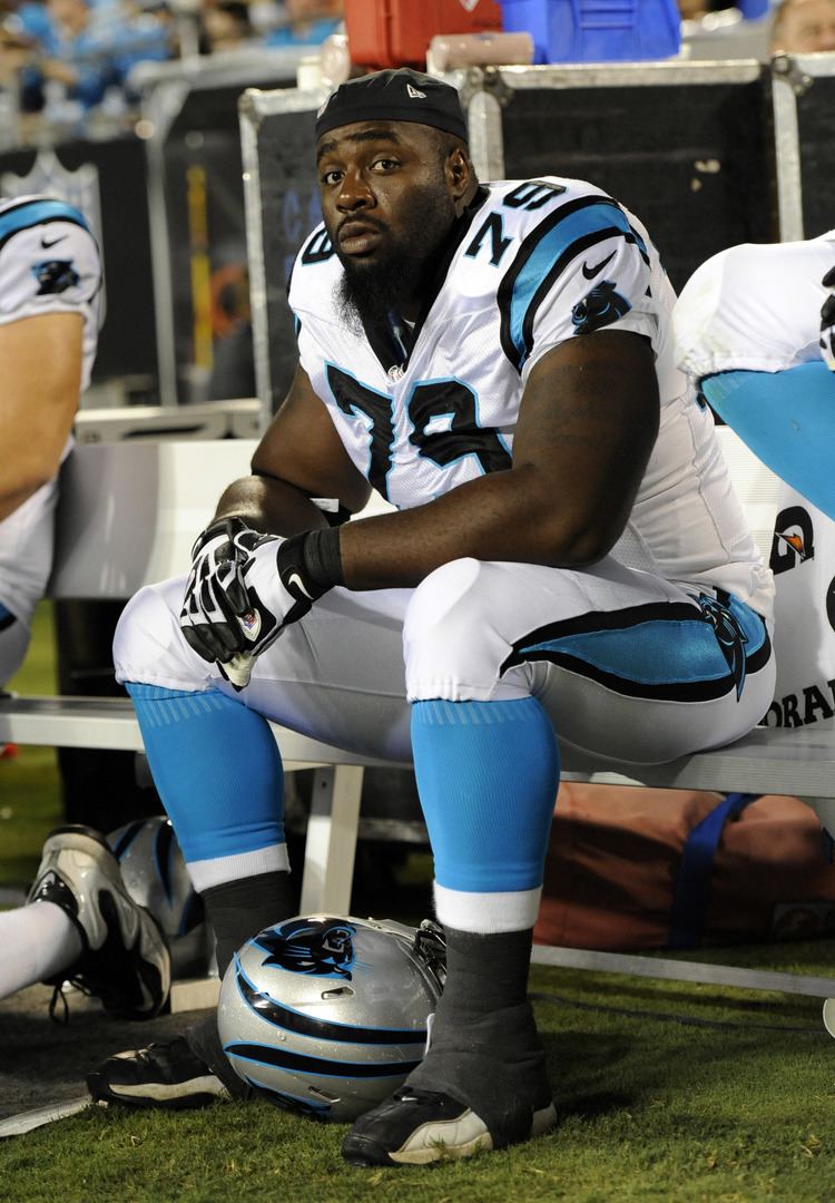 Justin Wells Carolina Panthers guard Justin Wells cools down on the sideline