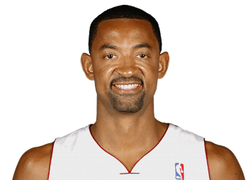 Juwan Howard smiling with a beard and mustache while wearing a white  jersey with the NBA logo